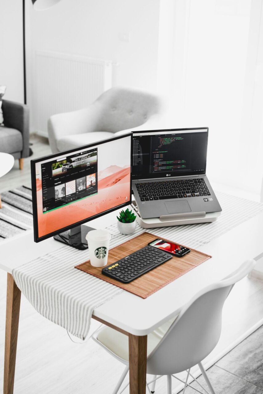 Beginner planning online income costs with notebook and calculator