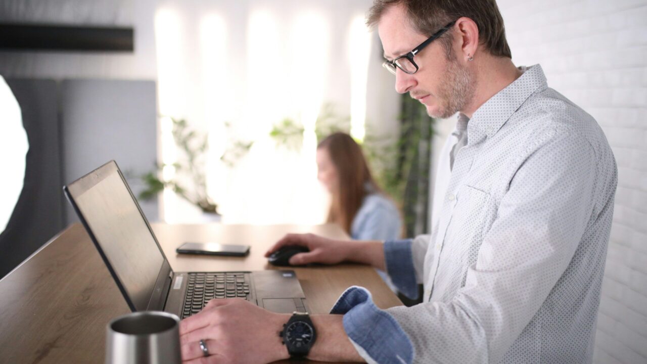 GuysAtStandingDesk scaled e1774557185980